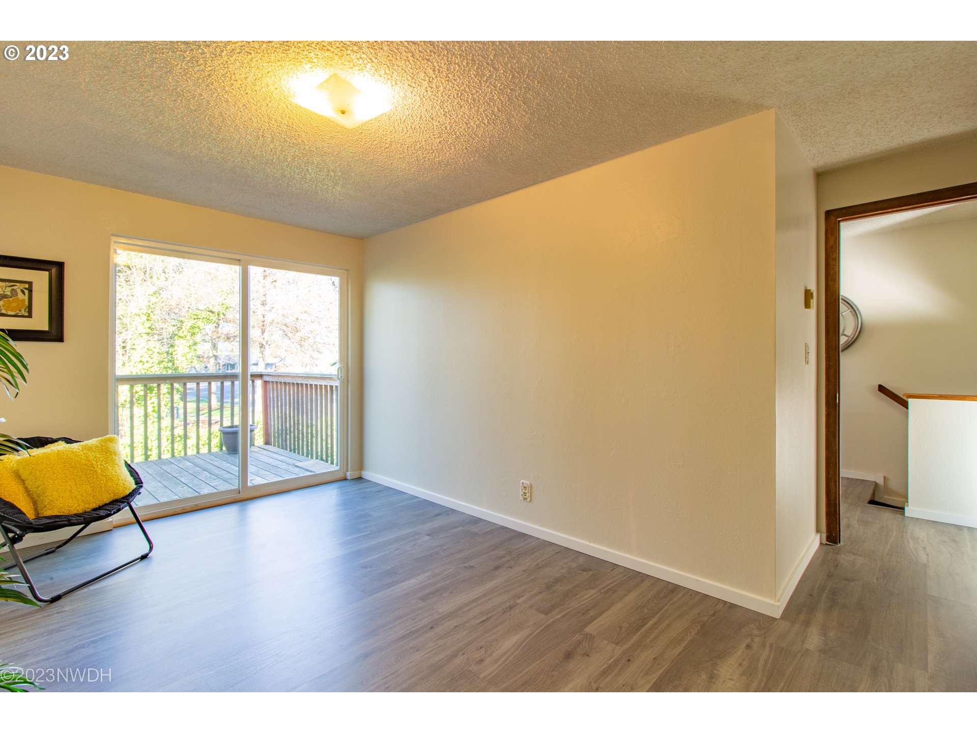 1302 Quaker Street Eugene, OR 97402 - Photo 26 of 28 a view of a room with wooden floor and windows