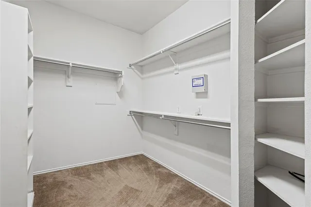 a view of an empty walk in closet