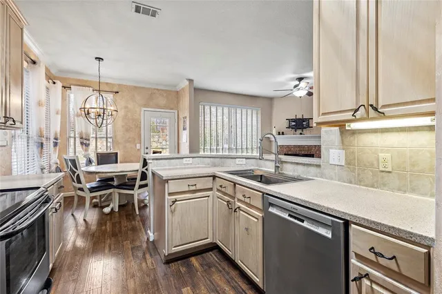 a kitchen with a sink stove and cabinets