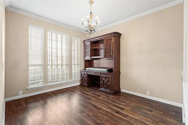 a view of livingroom with furniture chandelier fan and windows