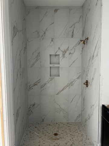 a front view of a house with garage