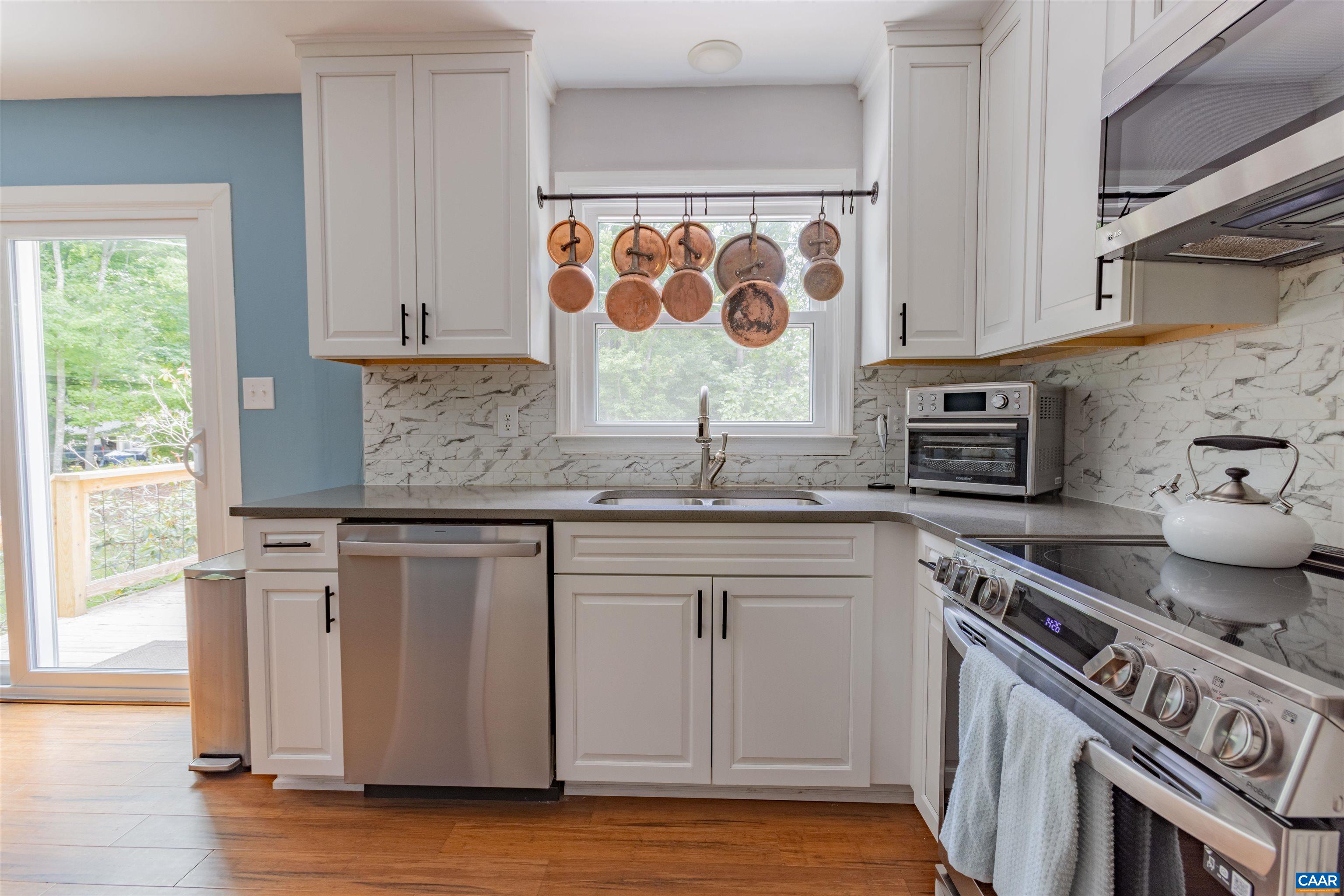 2550 Proffit Road Charlottesville, VA 22911 - Photo 3 of 41 a kitchen with stainless steel appliances granite countertop a sink stove and cabinets