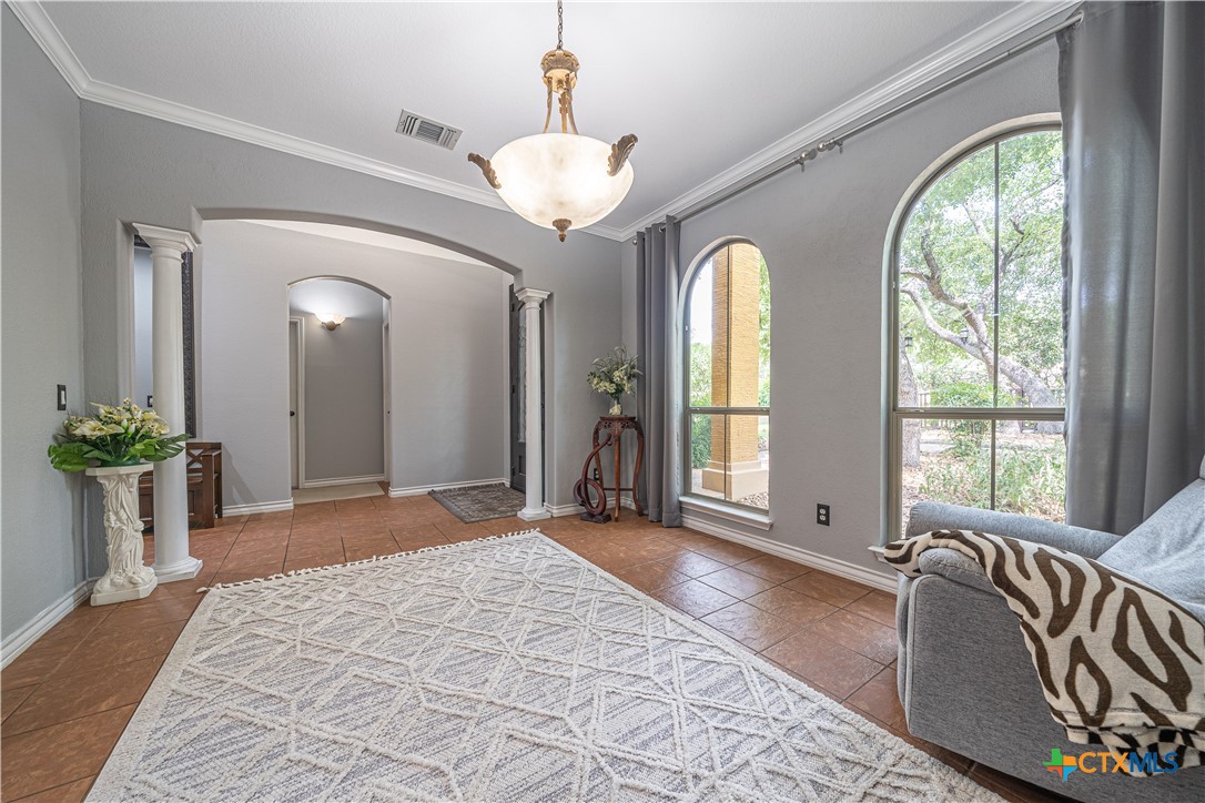 519 Long Meadow Spring Branch, TX 78070 - Photo 6 of 33 a spacious bedroom with a large bed and a chandelier