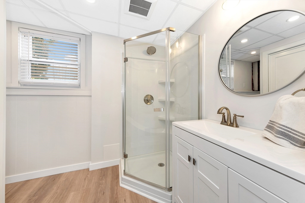 2 Morningside Drive Danvers, MA 01923 - Photo 15 of 25 a bathroom with a sink a vanity a mirror and shower