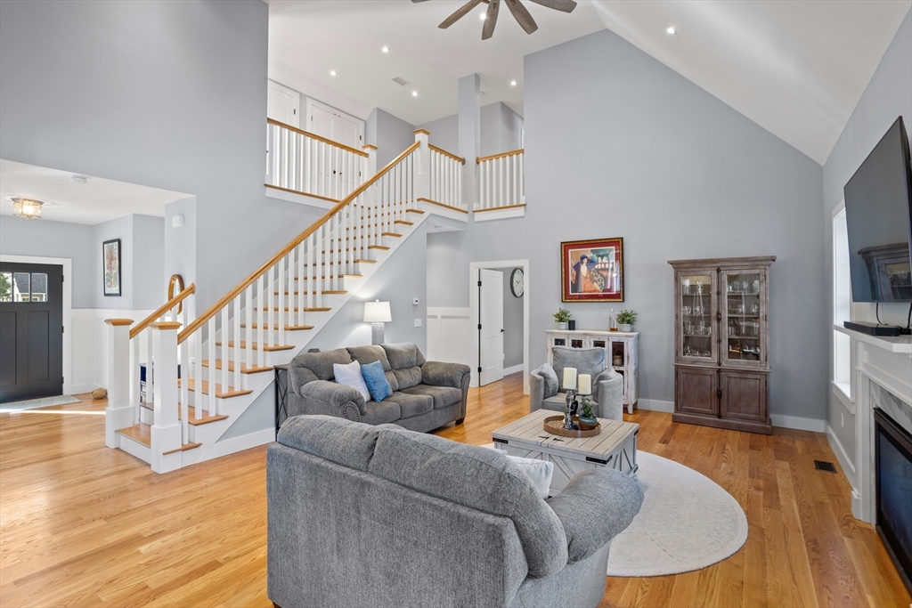135 South Road Holden, MA 01520 - Photo 13 of 42 a living room with furniture or wooden floor and a flat screen tv