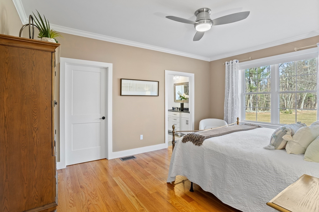 135 South Road Holden, MA 01520 - Photo 15 of 42 a bedroom with a bed ceiling fan and a window
