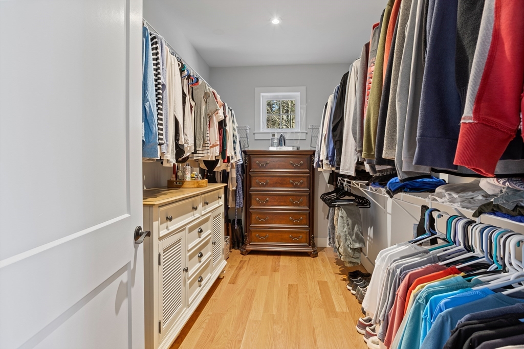 135 South Road Holden, MA 01520 - Photo 20 of 42 a view of walk in closet with clothes and shoes