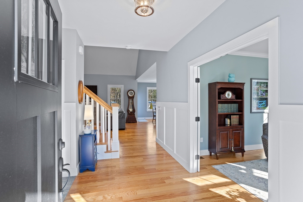 135 South Road Holden, MA 01520 - Photo 2 of 42 a view of a hallway with wooden floor and windows