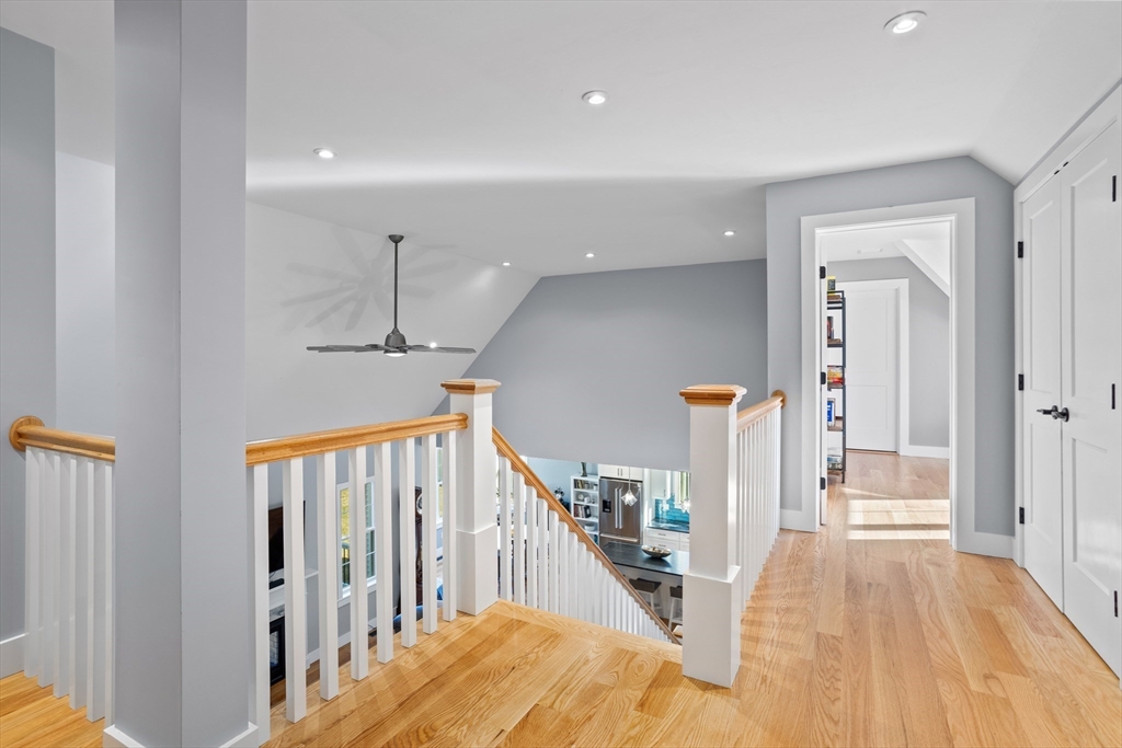 135 South Road Holden, MA 01520 - Photo 22 of 42 a view of a hallway with wooden floor and staircase
