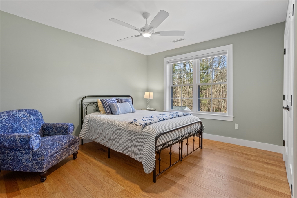 135 South Road Holden, MA 01520 - Photo 24 of 42 a bedroom with a large bed and a couch