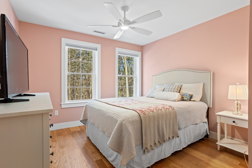 135 South Road Holden, MA 01520 - Photo 25 of 42 a bedroom with a bed and a flat tv screen on dresser