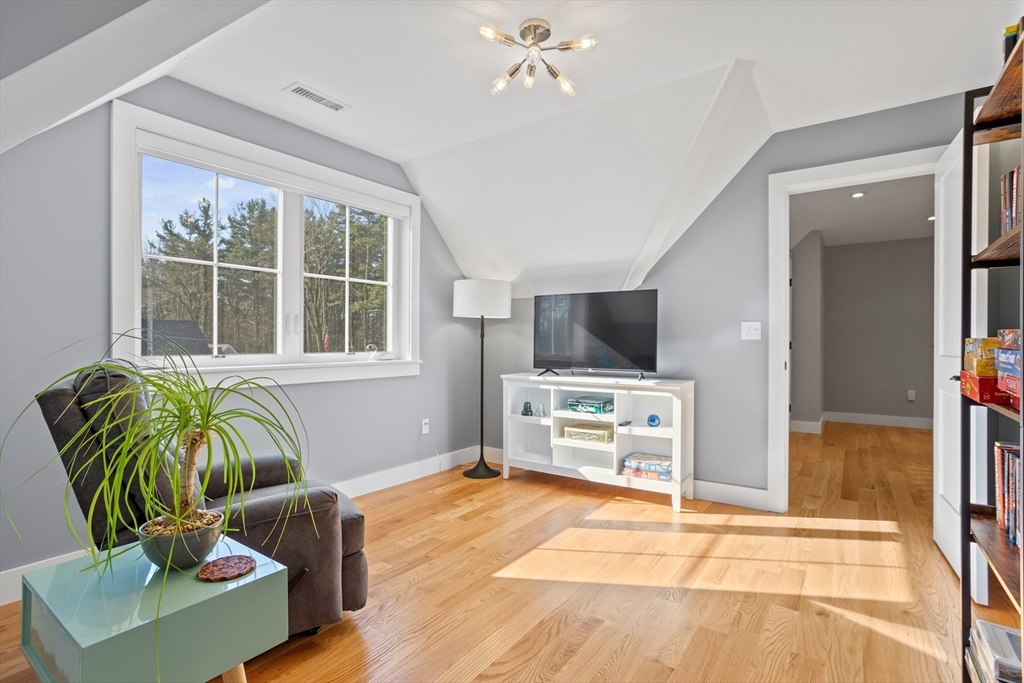 135 South Road Holden, MA 01520 - Photo 26 of 42 a living room with furniture and a flat screen tv