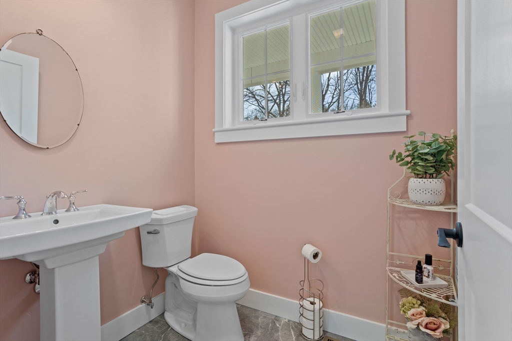 135 South Road Holden, MA 01520 - Photo 27 of 42 a bathroom with a toilet a sink and mirror
