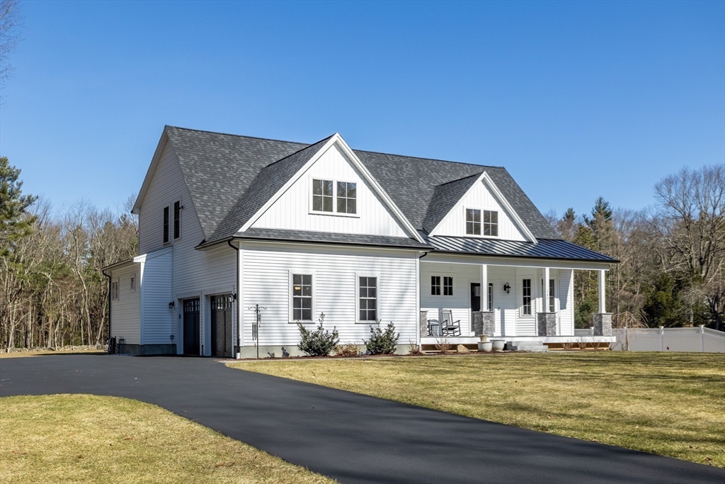 135 South Road Holden, MA 01520 - Photo 31 of 42 a front view of a house with swimming pool having outdoor seating