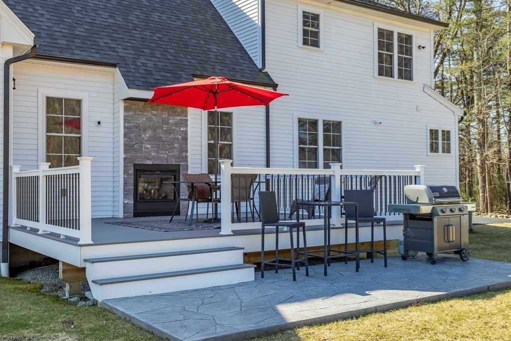 135 South Road Holden, MA 01520 - Photo 33 of 42 a balcony with furniture and a fireplace