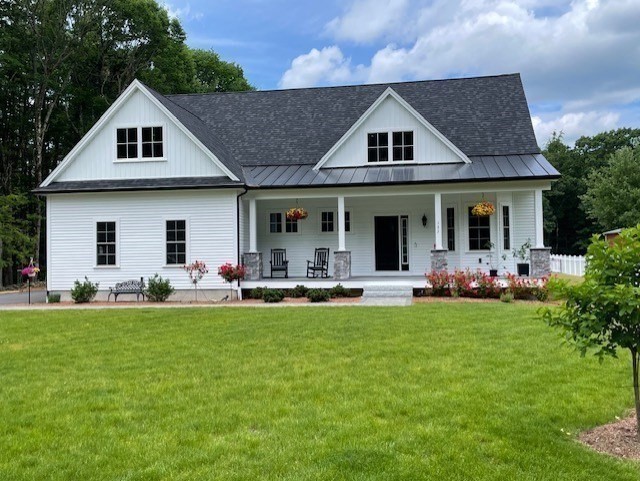 135 South Road Holden, MA 01520 - Photo 39 of 42 a view of a house with a yard and sitting area