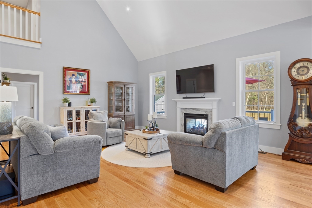 135 South Road Holden, MA 01520 - Photo 4 of 42 a living room with furniture a flat screen tv and a fireplace