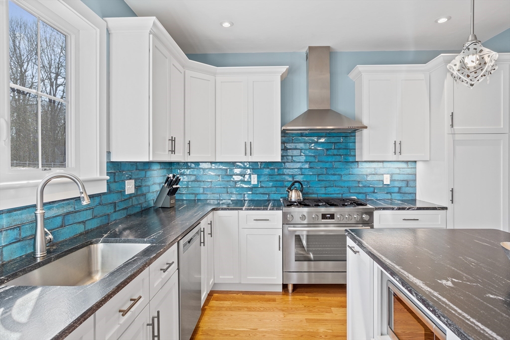 135 South Road Holden, MA 01520 - Photo 9 of 42 a kitchen with stainless steel appliances granite countertop a sink stove and cabinets