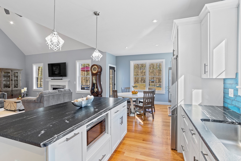 135 South Road Holden, MA 01520 - Photo 10 of 42 a large kitchen with lots of counter space a sink appliances and living room view