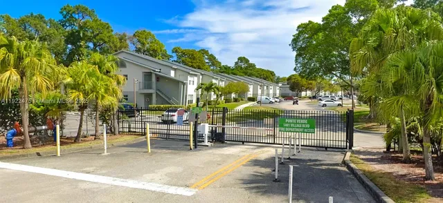 a view of a chairs and table in backyard