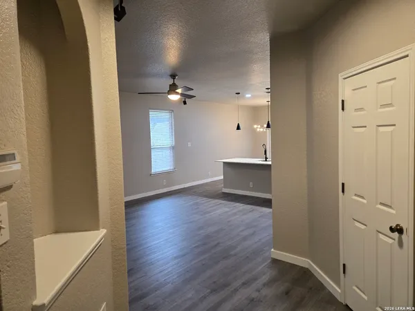 a bedroom with bed and a large window
