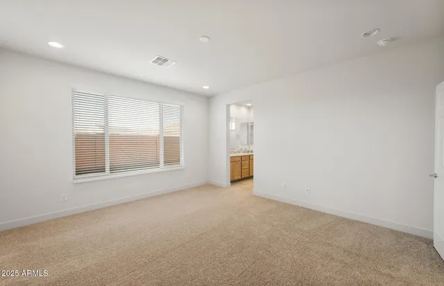 a view of a livingroom with furniture and an entryway
