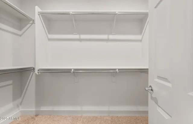a bathroom with a granite countertop sink a mirror and a shower