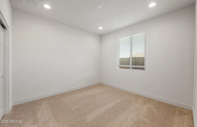 a bathroom with a granite countertop sink a toilet and bathtub