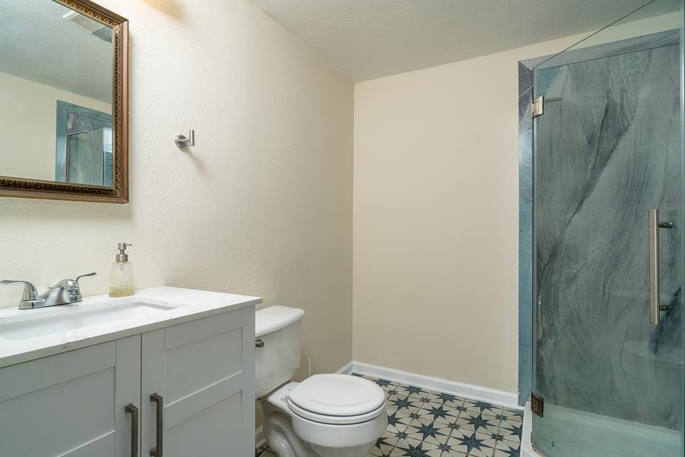 2574 Spaders Church Road Harrisonburg, VA 22801 - Photo 12 of 28 a bathroom with a sink a toilet a shower and a mirror