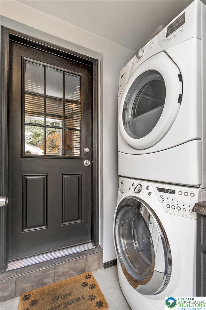 365 Rock Street Easton, PA 18042 - Photo 18 of 50 A convenient laundry area features stacked units adjacent to a practical exterior door.