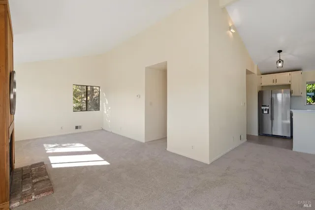 a view of livingroom with furniture window and front door