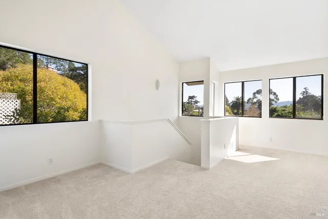 a view of a room with an entryway and a fireplace
