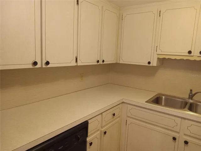 a view of a kitchen with cabinets