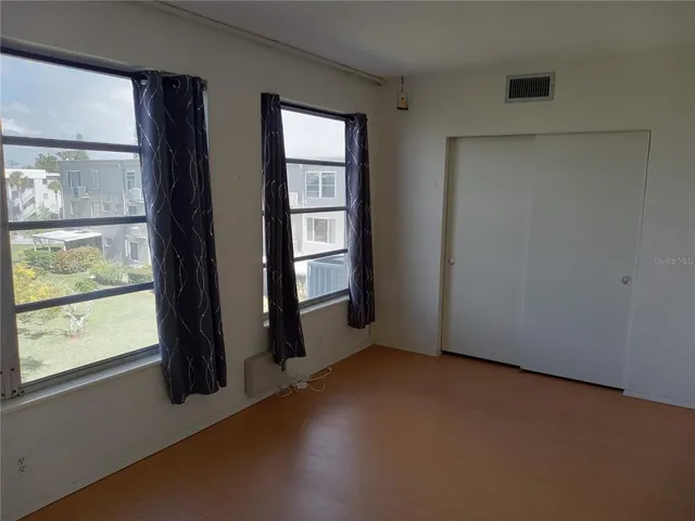 an empty room with windows