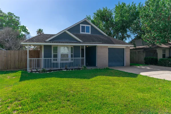 a front view of a house with yard