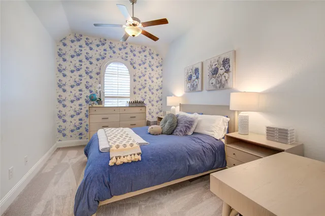 a bedroom with bed and window