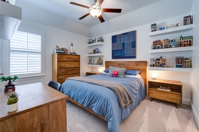 a bedroom with a bed and dresser