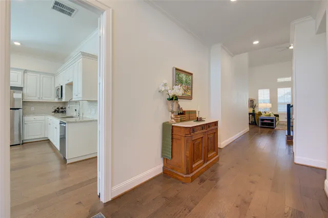 a view of kitchen with sink and cabinets