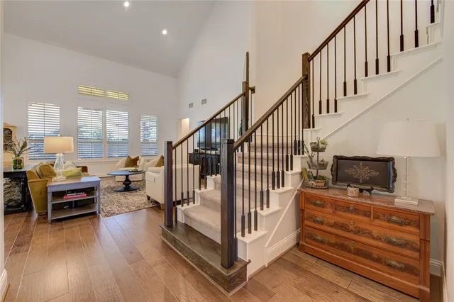 a view of entryway livingroom and hall with wooden floor
