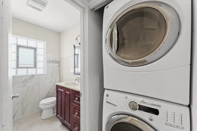 a bathroom with a toilet a sink and a mirror