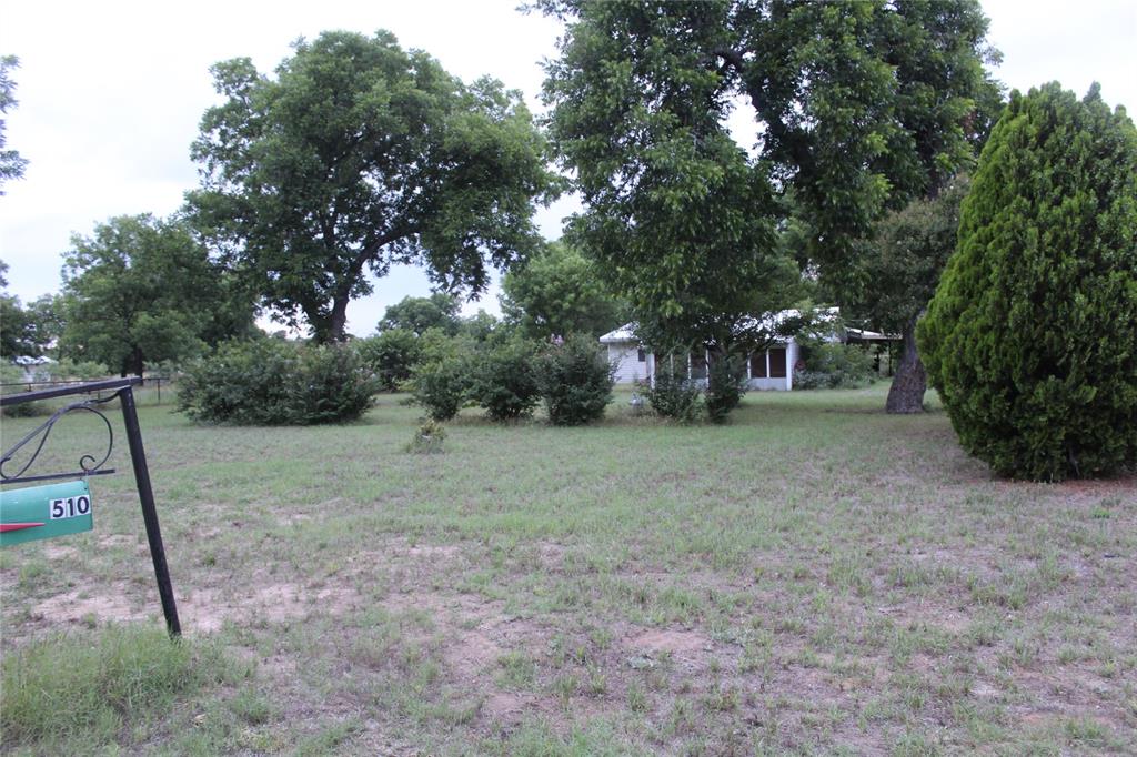 510 Hamby Road Clyde, TX 79510 - Photo 22 of 23 Expansive front yard featuring mature shade trees and established shrubbery