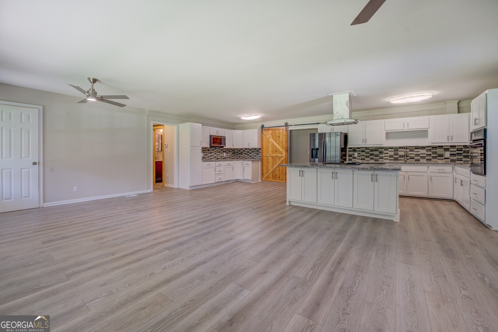 635 Jackson Lake Road Mansfield, GA 30055 - Photo 14 of 68 a view of a kitchen with a sink and microwave