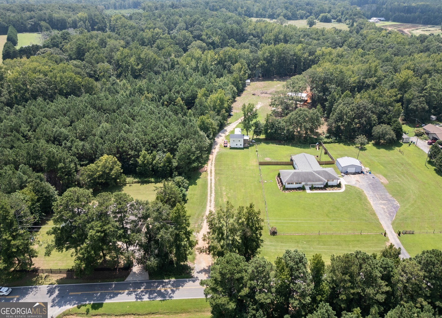635 Jackson Lake Road Mansfield, GA 30055 - Photo 2 of 68 an aerial view of a house with a yard