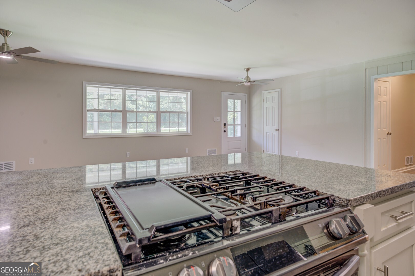 635 Jackson Lake Road Mansfield, GA 30055 - Photo 22 of 68 a stove top oven sitting inside of a kitchen