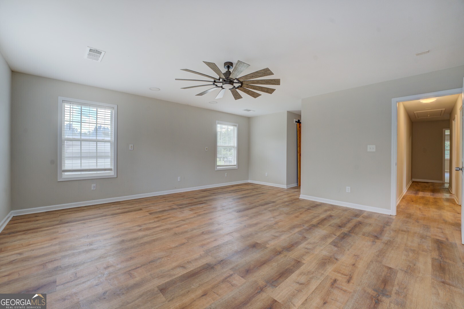 635 Jackson Lake Road Mansfield, GA 30055 - Photo 24 of 68 wooden floor in an empty room with a window