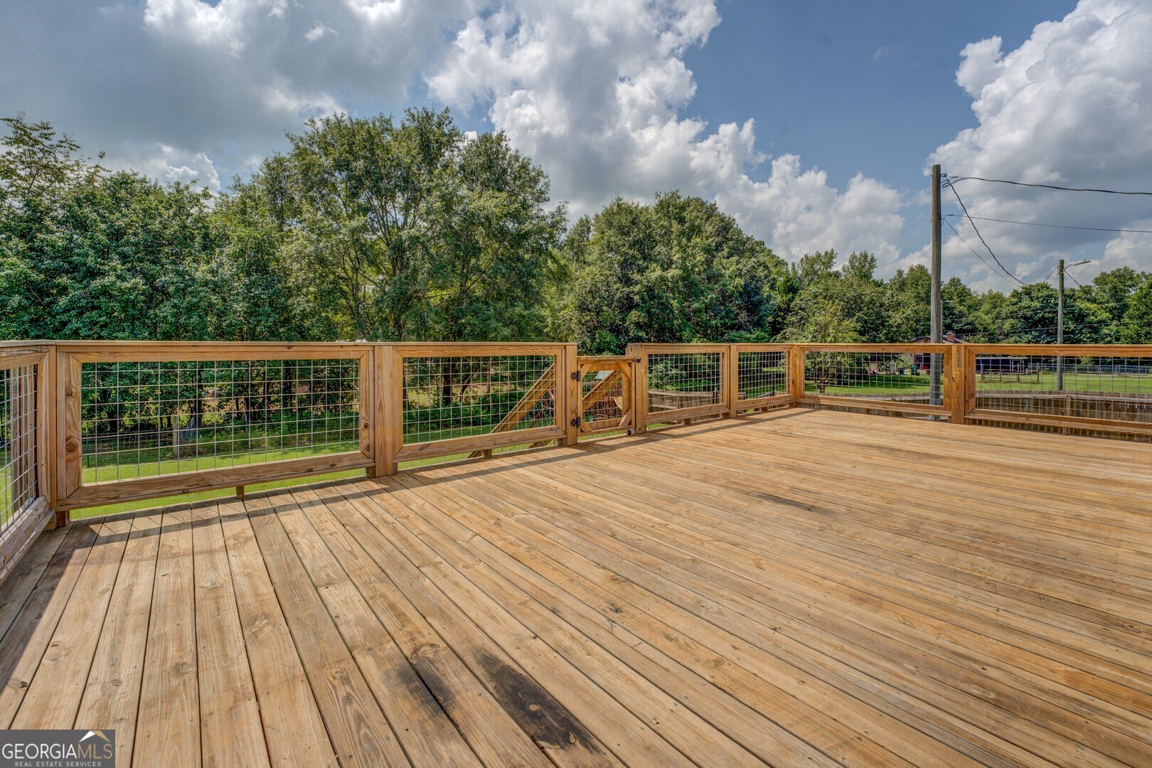 635 Jackson Lake Road Mansfield, GA 30055 - Photo 26 of 68 a view of outdoor space with deck and backyard