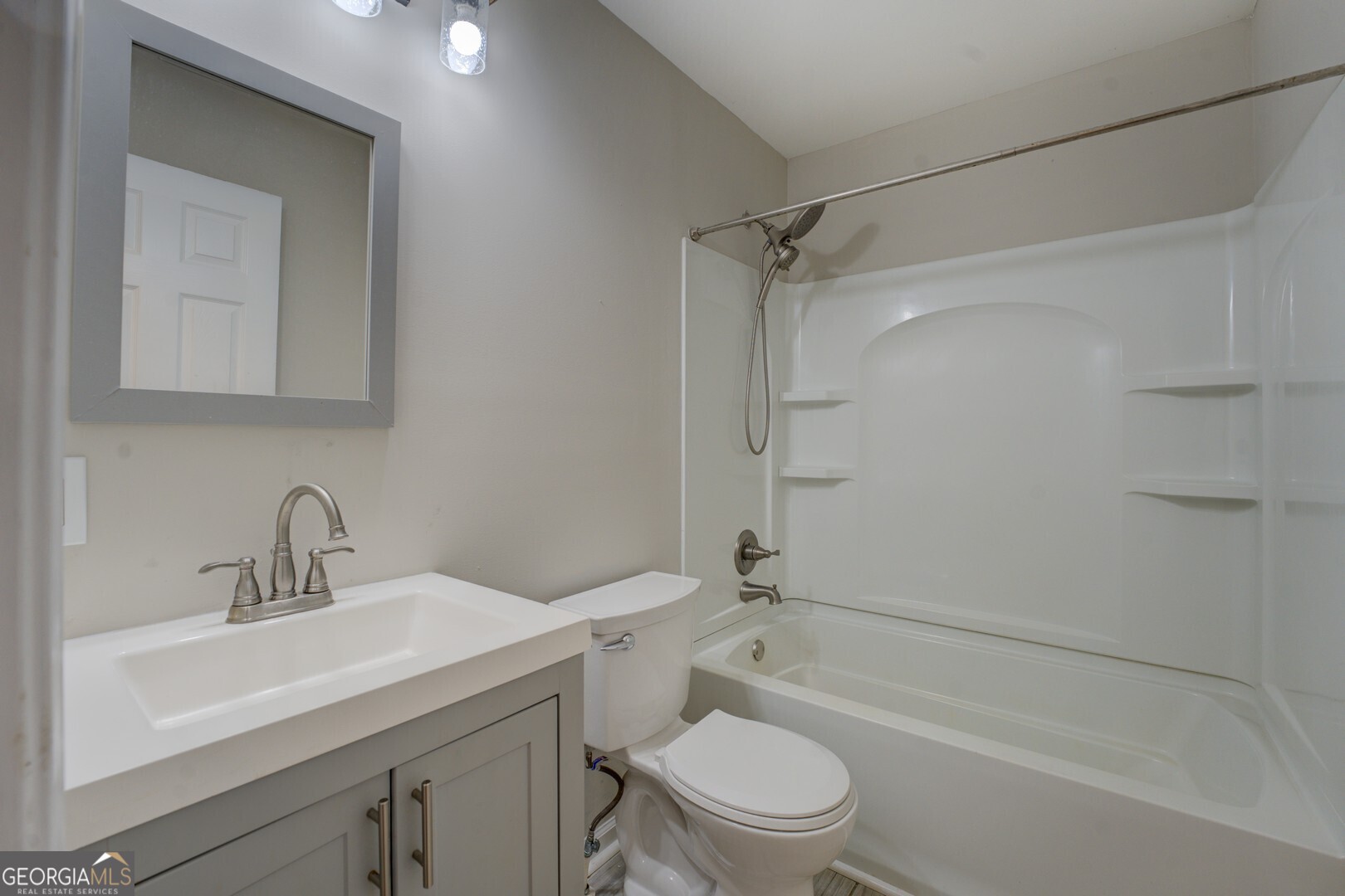 635 Jackson Lake Road Mansfield, GA 30055 - Photo 37 of 68 a bathroom with a sink toilet and shower