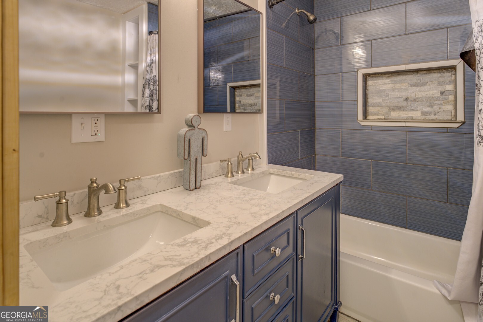 635 Jackson Lake Road Mansfield, GA 30055 - Photo 42 of 68 a bathroom with a granite countertop sink and a mirror
