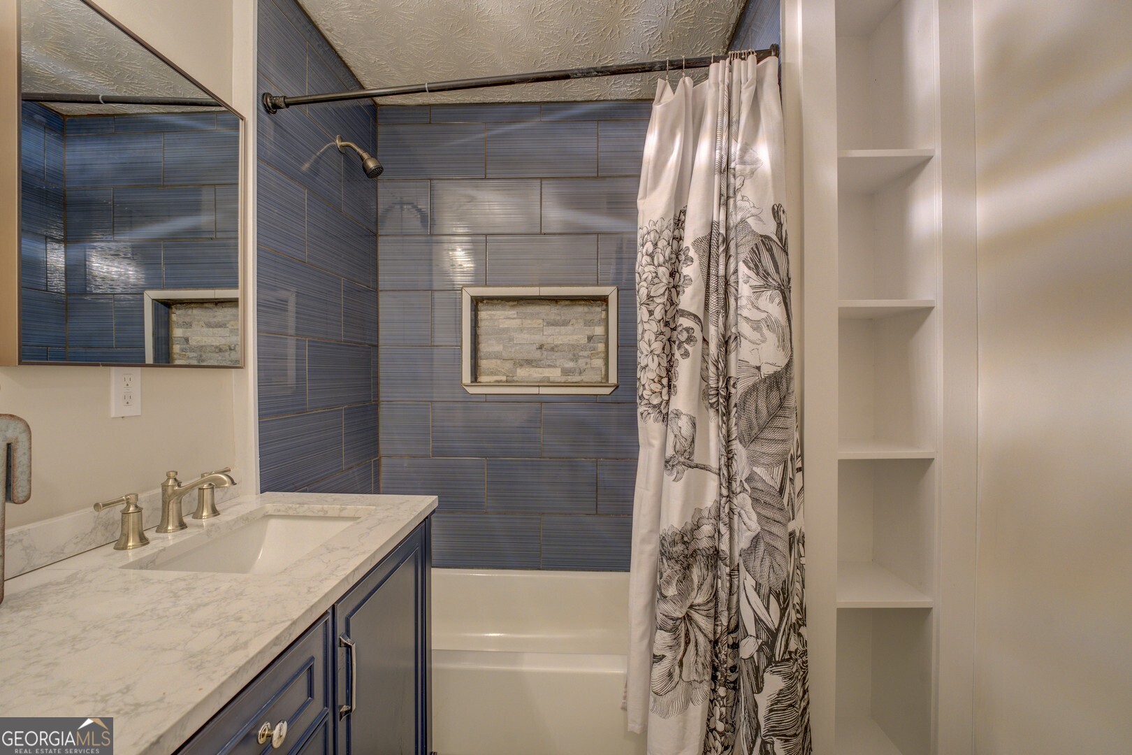 635 Jackson Lake Road Mansfield, GA 30055 - Photo 43 of 68 a bathroom with a granite countertop shower a sink and a mirror