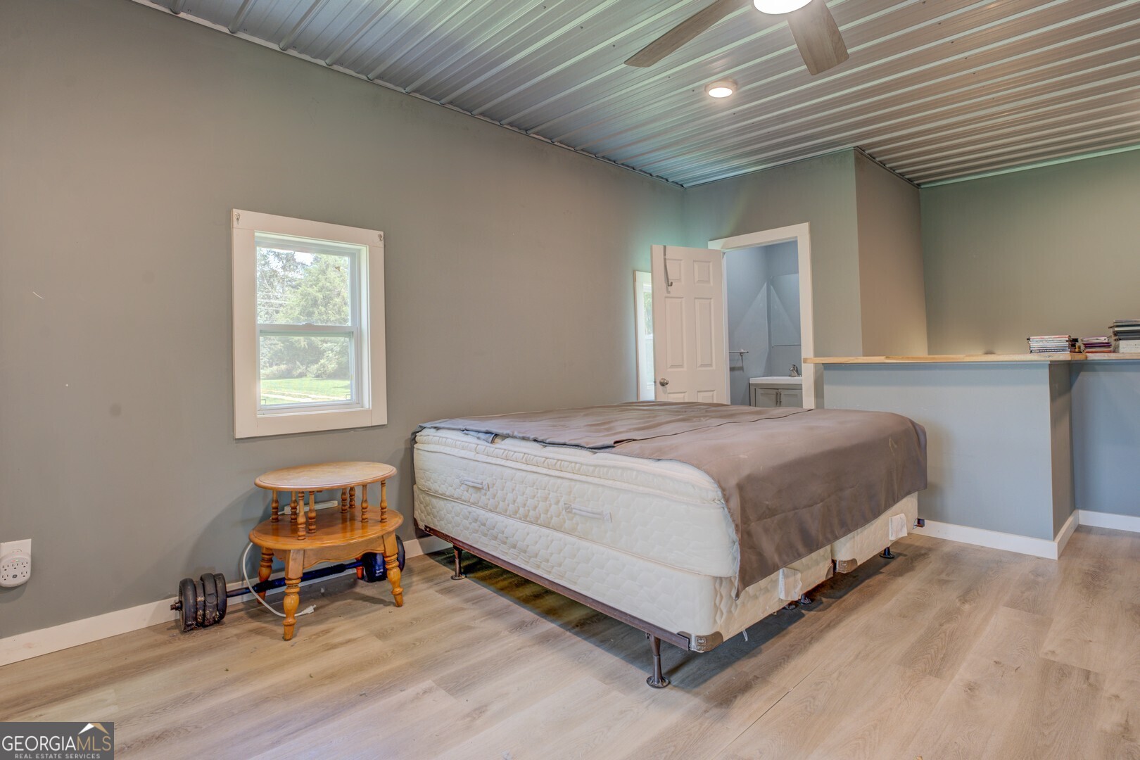 635 Jackson Lake Road Mansfield, GA 30055 - Photo 52 of 68 a bedroom with a bed and a window